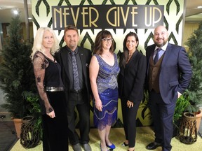 Pictured from left at Wood's Homes' 25th Never Give Up Gala Oct. 22 are Wendy Johansson and her husband Bjorn Johansson (Wood's Homes CEO); Brenda Cherry (Wood's Homes board chair); Renee Hopfner, (Wood's Homes Foundation chair); and Bryan Goehringer (Wood's Homes Foundation director). Photo, Bill Brooks