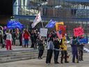 About 150 people rallied against COVID-19 restrictions outside the Calgary Municipal Building on January 6, 2021. 