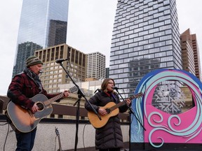 Tim Lecock, left, and Shaye Zadravec perform at the rooftop announcement of Chinook Blast at Calgary Marriott Downtown on Tuesday, January 25, 2022. Azin Ghaffari/Postmedia