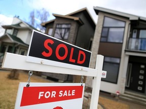 A house for sale and sale sign is seen in this file photo.