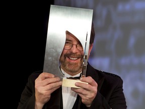 Will Ferguson, author of the novel 419, celebrates winning the 2012 Scotiabank Giller Prize at Toronto's Ritz-Carlton hotel, Tuesday. Peter J. Thompson, Postmedia