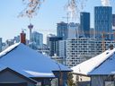 The Calgary skyline is seen from behind some houses in Bridgeland on Tuesday, November 8, 2022.