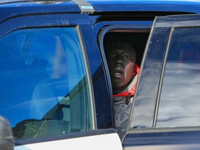 A suspect is being held in a police vehicle after at least 10 people were assaulted in downtown Calgary on Tuesday morning.