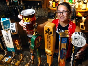 Server Jade Heathfield of Bottlescrew Bill's Pub, which will serve customers earlier during the World Cup.