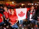 Canadian soccer fans sing the national anthem before game action as fans gather at the Ship & Anchor in Calgary on Wednesday, Nov. 23, 2022, to watch Canada's first World Cup match in Qatar against Belgium.