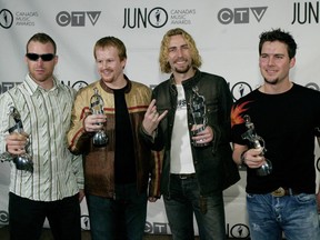 Nickelback pose backstage with their Juno Awards at the 2004 Juno Awards Ceremony at Rexall Place in Edmonton.