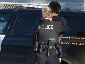 A young man is arrested Tuesday November 15, 2022 in southeast Calgary in connection with a stabbing at Jack James High School. The house where the person was arrested is located a short distance from the school.