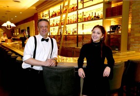 Lead bartender Jason Smith and hostess Nellie Baker at FinePrint on Stephen Avenue in Calgary. Jim Wells/Postmedia