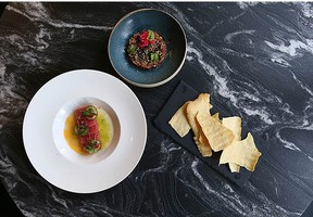 Tuna Crudo, Bison and Truffle Tartare, and Merlot Crackers (homemade) are featured in FinePrint.Jim Wells/Postmedia