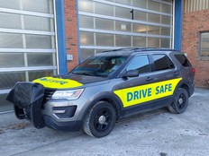 Calgary police add bright 'drive safe' stickers to photo radar fleet