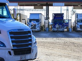Drivers fill up their trucks at the Roadking Truck Stop in Calgary on Monday, November 14, 2022. Record high diesel prices were seen across the country.