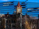 Calgary's old city hall was framed against the new building on Monday, November 21, 2022. 