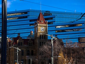 Calgary's old city hall was framed against the new building on Monday, November 21, 2022.