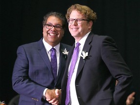 FILE PHOTO: Calgary mayor Naheed Nenshi shakes hands with Gian-Carlo Carra as members of Calgary’s new council were sworn in during the Organizational Meeting of Council Swearing-In Ceremony of the Members of Council – Elect at the Calgary Municipal Building on Monday October 23, 2017.