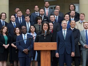 Alberta Premier Danielle Smith speaks to the media outside Government House following the swearing-in of her new cabinet ministers, in Edmonton on Monday, Oct. 24.