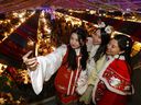 Left to right, Shuxin Wang, Lydia Li and Mia Wang of the Calgary Hanfu Society take a selfie at the Spruce Meadows International Christmas Market.  The market was among the top 5 in the world.  Photo taken in Calgary on Sunday November 20, 2022.