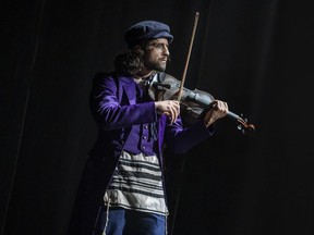Ali Arian Molaei (The Fiddler) and the Company of the North American Tour of Fiddler on the Roof. Photo by Joan Marcus