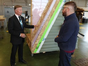 Homebuilder Jay Westman chats with SAIT building trades student Michael Orr after he announced a $15 million scholarship program for building trades students at SAIT and NAIT in October.