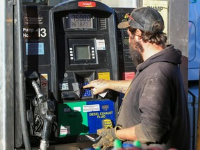 Jordan Hazelwood fills up his semi truck at the Road King truck stop in Calgary on Monday, Nov. 14, 2022. Record high diesel prices were seen across the country.