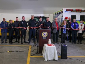 Participants stand with a red ribbon at this year's launch of MADD Calgary's Project Red Ribbon to promote sober driving during the holiday season on Wednesday, November 16, 2022.