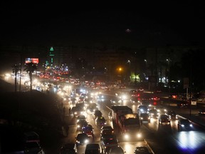 A view of a traffic jam with smoke of burning rubbish in the district of Maadi, ahead of the COP27 summit to be held in Egypt, in Cairo, Egypt November 2, 2022.