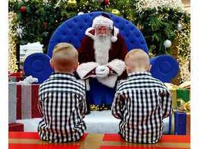 Young children believe in the wonder of Santa, even in a mall setting.