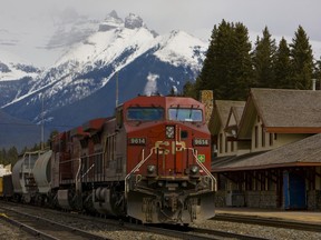 A file photo shows a Canadian Pacific freight train pulling into the railway station in Banff. The provincial government is expressing interest in helping develop a new passenger rail link to Banff National Park.