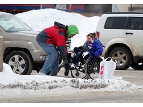 In a scenario typical of our winter cities, a Good Samaritan must come to the rescue of a woman in a wheelchair who became stuck in the ice and snow while crossing a street in Edmonton.