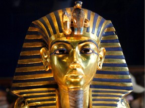 On this day in history in 1922, King Tutankhamen's tomb was discovered by British archeologist Howard Carter.  Pictured, the golden mask Tutankhamen is displayed at the Egyptian museum in Cairo, Egypt. He's been dead for thousands of years, and his body was discovered a century ago. And yet Tutankhamen - the mysterious boy pharoah whose tomb was discovered intact in 1922 - continues to capture imaginations and fuel lingering questions that still baffle experts.