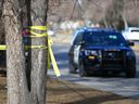 Calgary police at the scene of the fatal shooting in the 5200 block of Memorial Drive S.E. on March 28, 2021.