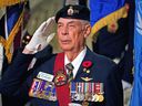 A member of the Royal Canadian Legion, Mack Tory, salutes at a memorial service held at the Alberta Legislature on Thursday, November 3, 2022.