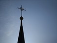 WALLERDORF, GERMANY - SEPTEMBER 21:  A cross stands on the spire of a Catholic church on September 21, 2018 in Wallerdorf, Germany. The German Bishops Conference is due to release a report on September 25, 2018 in Fulda on sexual abuse by German Catholic priests. According to the report there have been at least 3,677 victims, mostly boys, of abuse in the years between 1946 and 2014.  (Photo by Sean Gallup/Getty Images) ORG XMIT: 775184490