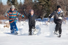 Amon, Nick and Nelson Penner snowshoeing West Bragg Creek.photo, Andrew Penner