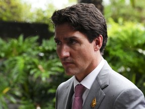 Prime Minister Justin Trudeau makes his way to his vehicle as he leaves the G20 Leaders Summit in Bali, Indonesia on Wednesday, Nov. 16, 2022.