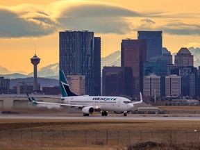 A WestJet Boeing 737 takes off from Calgary International Airport on November 18, 2021.