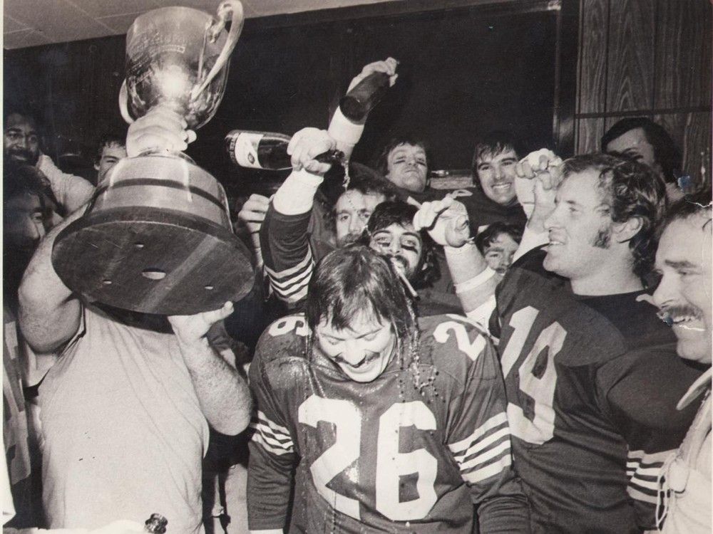 A shower of champagne for 1975 game hero Dave Cutler. Postmedia archives.