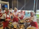 Volunteers with Brown Bagging for Calgary's Kids prepare school lunches. 