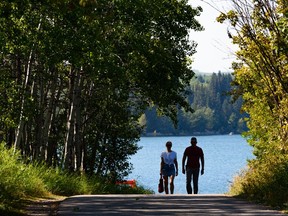 Pedestrians enjoy the sunny afternoon on on the pathway at south Glenmore park on Tuesday, September 6, 2022.