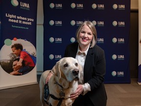 Luna Child and Youth Advocacy Center facility dog Webster and Karen Orser, CEO on November 29, 2022. The center is one of 75 plus agencies you can help via the Calgary Herald Christmas Fund; go to calgaryherald.com/christmas. Azin Ghaffari/Postmedia