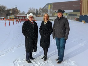 From left, Mike Garcia, president of Matthews Southwest Hospitality;  Kate Thompson, CMLC President and CEO;  and Calgary Stampede CEO Joe Cowley at the site Tuesday, Dec. 6, 2022, of a new hotel to be built at Stampede Park.