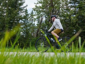 A cyclist enjoys a sunny day at Fish Creek Provincial Park in Calgary on Thursday, June 30, 2022. Friends of Fish Creek Provincial Park Society is set to receive a $750,000 investment from the province over three years for conservation and program expansion.