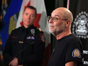 Mark Randall, a board member with the Calgary Police Service's Gender and Sexual Diversity Advisory Board, speaks after Calgary Police Chief Constable Mark Neufeld, (background) acknowledged the 20th anniversary of the Goliath's Bathhouse raid and the harm it caused to Calgary's gay community during a press conference on Monday, December 12, 2022. 
Gavin Young/Postmedia