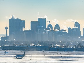 A WestJet plane prepares for takeoff at Calgary International Airport on a bitterly cold afternoon on Monday, December 19, 2022.