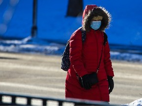 Calgarians braved the cold as they walked in the freezing -40 C wind chill in downtown Calgary on Monday, December 19, 2022. Extreme cold temperatures are forecast for most of the week in the city.