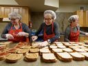 Brown Bagging for Calgary's Kids volunteers prepare sandwiches for school kids at the kitchen in Emmanuel Christian Reformed Church on Wednesday, December 21, 2022.