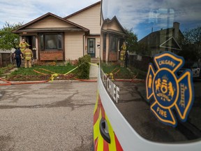 Firefighters remained on the scene Wednesday morning, May 18, 2022, of a home on the 100 block of Deerview Way Southeast, which was the scene of a fatal fire late Tuesday night.  One man died in the fire.