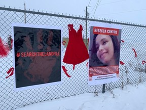 An image of murder victim Rebecca Contois, along with a red dress and another poster with the phrase '#searchthelandfill' are seen at the entrance to the Brady Road Landfill on Thursday, as protesters continue to block access to the landfill, and demand a search for human remains.
