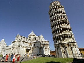On this day in history in 2001, Italy's Leaning Tower of Pisa reopened to the public after being closed for security reasons in 1990.  Franco Origlia photo;  Getty Images.