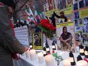 A protester lights candles next to portraits of Majid Reza Rahnavard, 23, and Mohsen Shekari, 23, who were both recently executed by Iranian authorities, during a demonstration by supporters of the National Council of Resistance of Iran on December outside the German ministry of foreign affairs.  12, 2022 in Berlin, Germany.  Iranian authorities said that Rahnavard was executed by hanging earlier today as punishment for the killing of two Iranian security personnel during recent street riots.  Popular protests have been ongoing in Iran since Mahsa Amini's death in September.