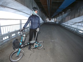 Brett Bergie poses near Center St and Riverfront Ave SE in Calgary on Sunday, December 4, 2022. The lower portion of the bridge is scheduled to open in the near future.